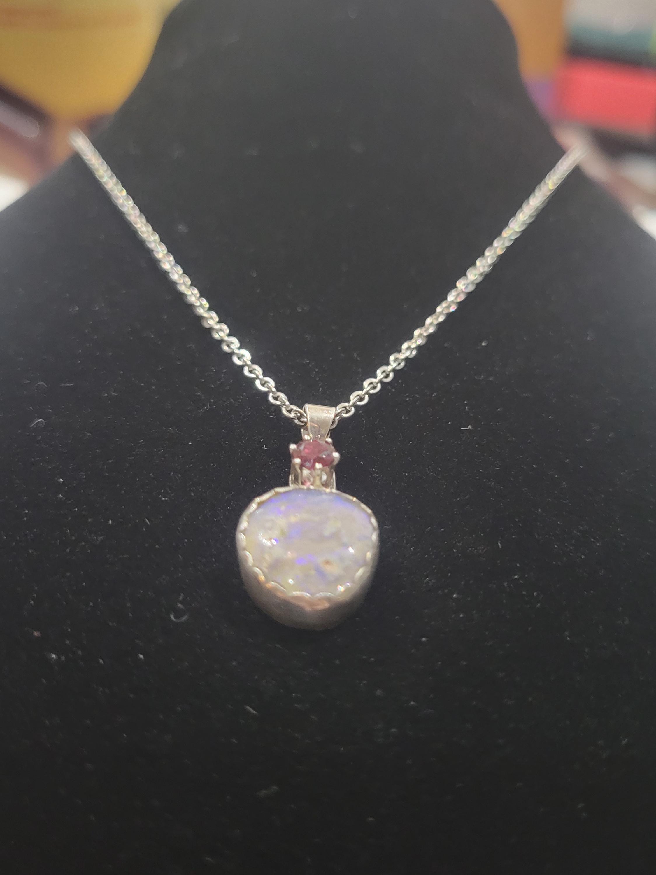 Christmas necklace featuring am Opal and a South Carolina Garnet