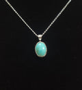 Small Oval Turquoise Pendant — Sterling Silver Bezel, 16” Silver-Toned Chain