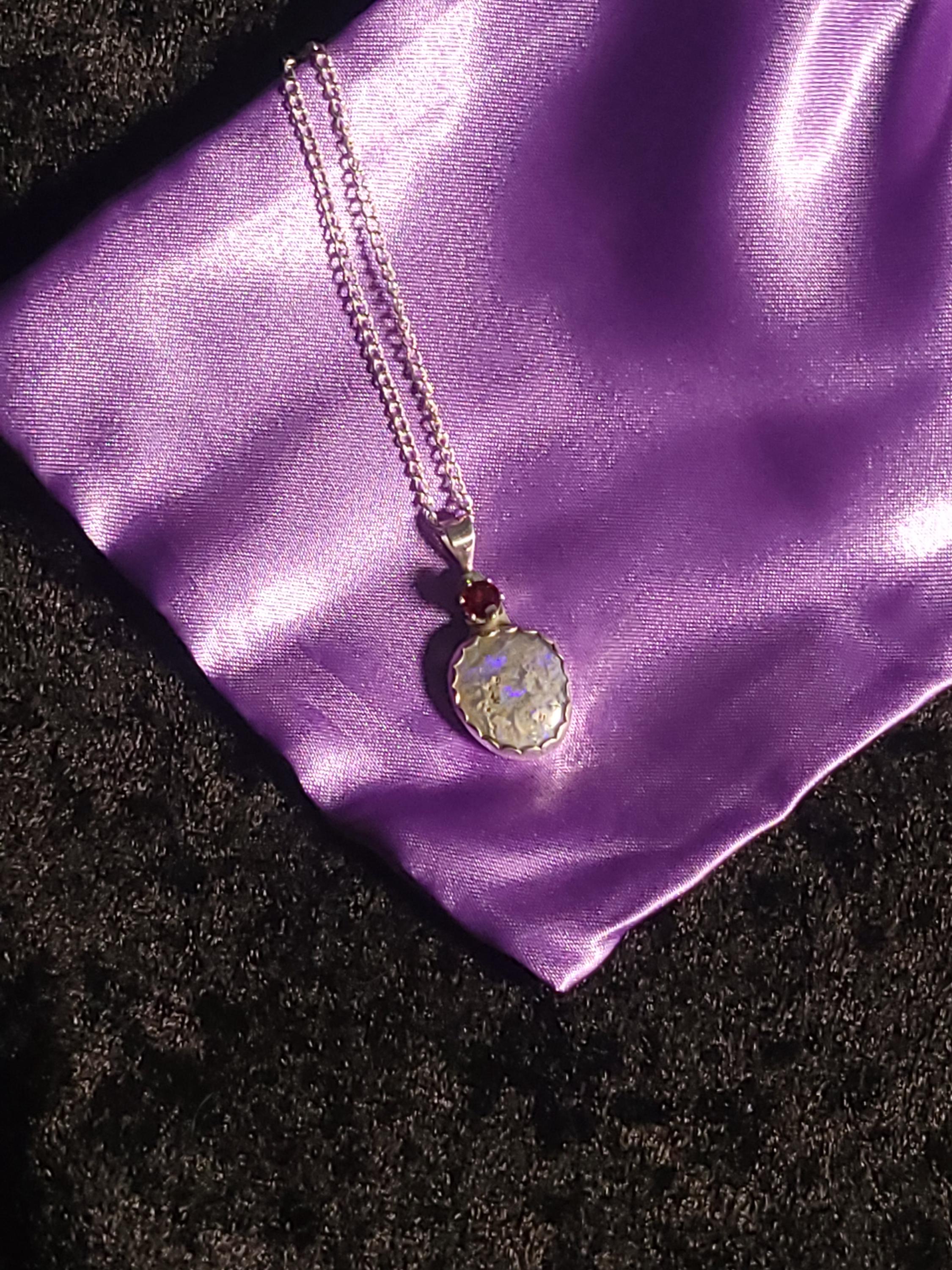 Christmas necklace featuring am Opal and a South Carolina Garnet