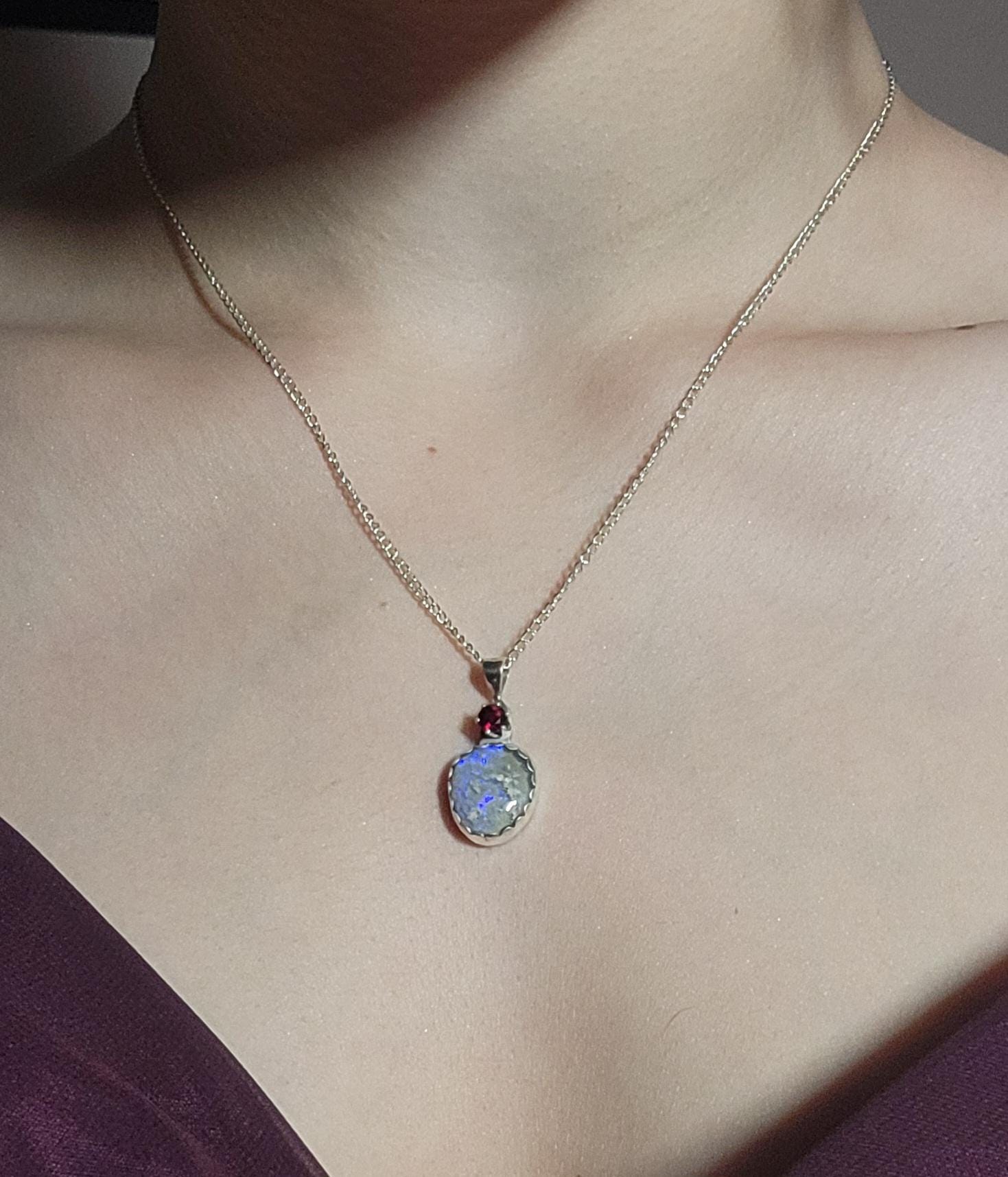 Christmas necklace featuring am Opal and a South Carolina Garnet