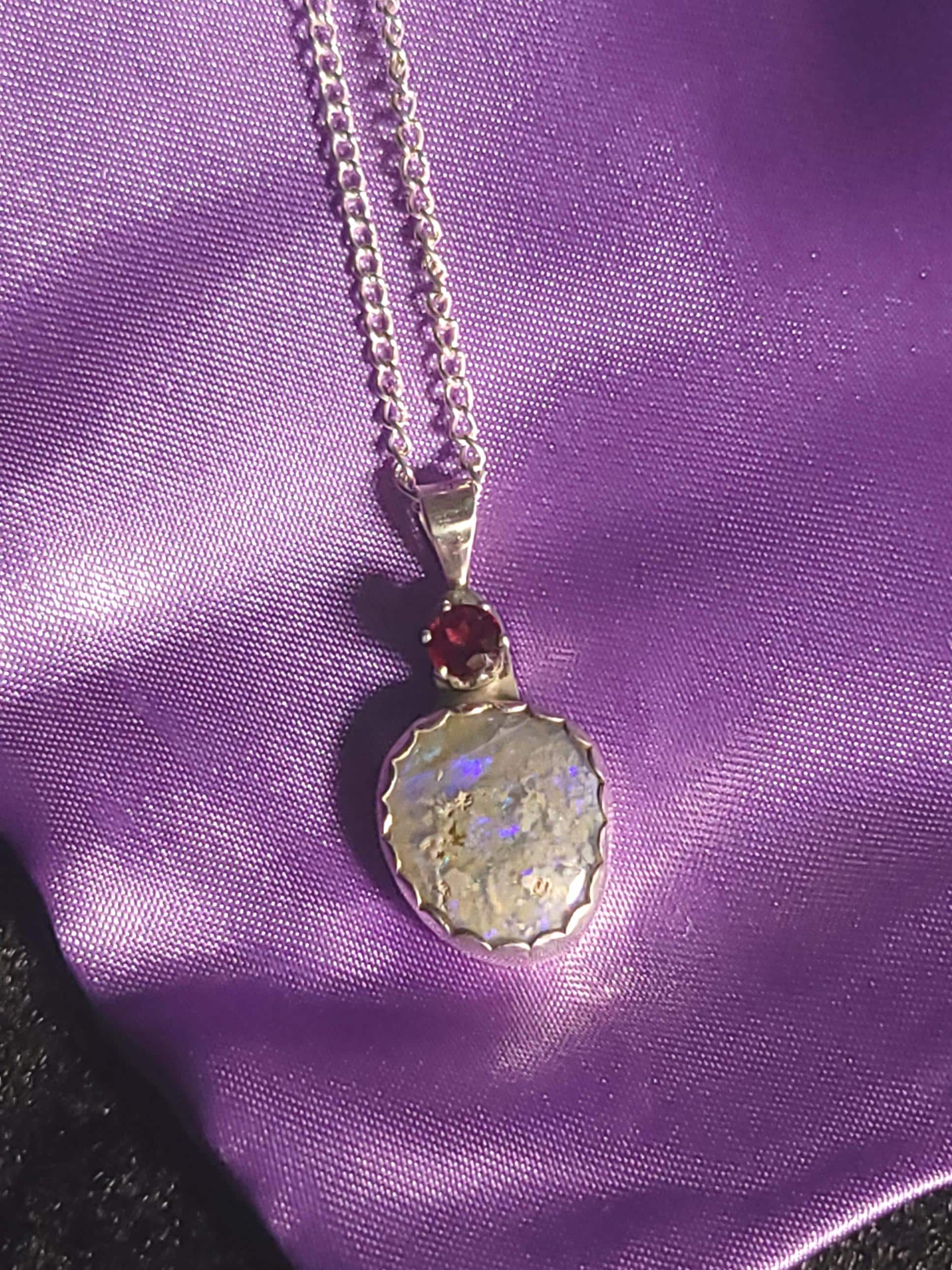 Christmas necklace featuring am Opal and a South Carolina Garnet